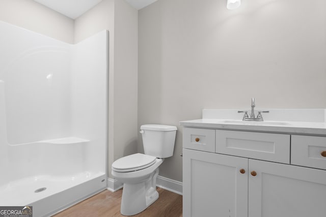 3 Honeysuckle Dr, Claxton, GA 30417 - bathroom featuring wood finished floors, vanity, and a shower