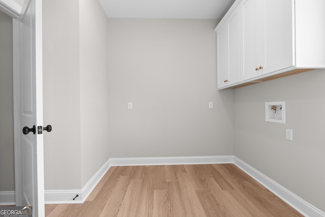 3 Honeysuckle Dr, Claxton, GA 30417 - washroom featuring cabinet space, light wood-type flooring, and washer hookup