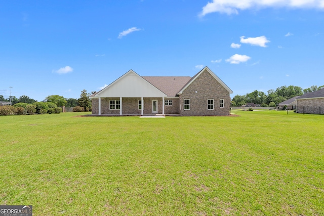 3 Honeysuckle Dr, Claxton, GA 30417 - back of house with a yard, a patio, and brick siding