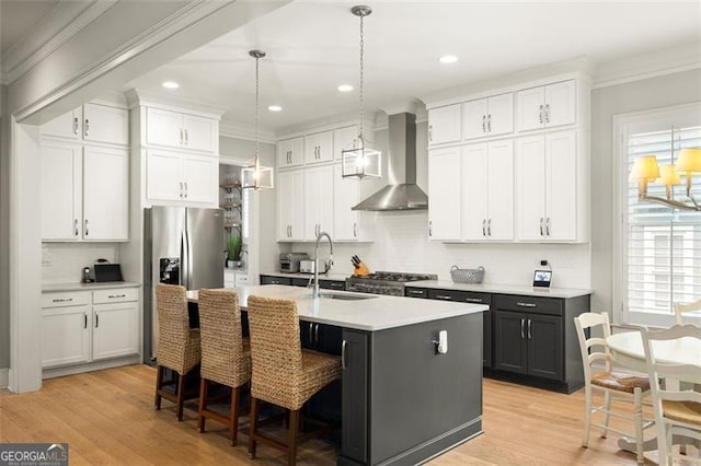 127 Oak Ln, Decatur, GA 30030 - kitchen with wall chimney exhaust hood, ornamental molding, white cabinetry, tasteful backsplash, and recessed lighting