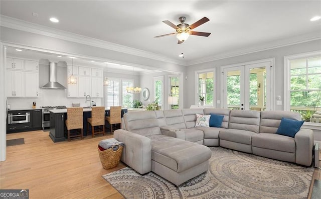 127 Oak Ln, Decatur, GA 30030 - living area with healthy amount of natural light, french doors, ceiling fan, light wood finished floors, and ornamental molding