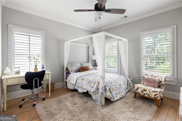 127 Oak Ln, Decatur, GA 30030 - bedroom with ornamental molding, wood finished floors, an office area, and a ceiling fan
