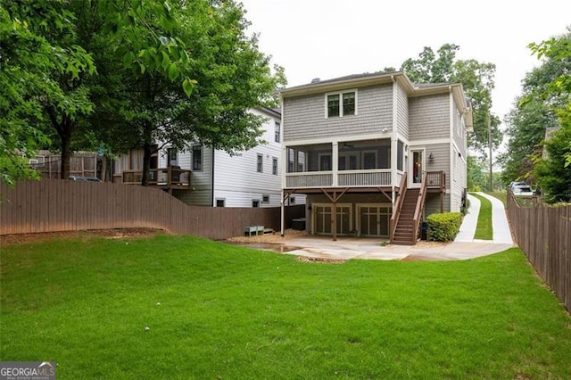 127 Oak Ln, Decatur, GA 30030 - back of house featuring a sunroom, a patio, a fenced backyard, and stairs