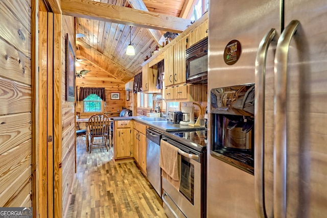 77 Falls View Dr, Dillard, GA 30537 - kitchen with appliances with stainless steel finishes, lofted ceiling, light wood-type flooring, wooden ceiling, and wooden walls