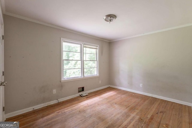 4201 Hicks Rd, Austell, GA 30106 - empty room with wood finished floors and ornamental molding