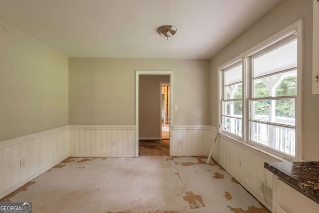 4201 Hicks Rd, Austell, GA 30106 - spare room with a wainscoted wall