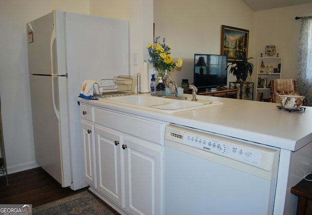 2887 Florence Dr, Gainesville, GA 30504 - kitchen featuring white appliances, dark wood-style flooring, white cabinetry, light countertops, and a peninsula