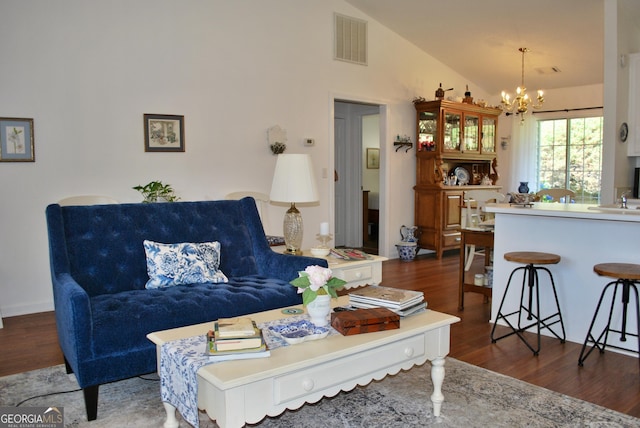 2887 Florence Dr, Gainesville, GA 30504 - living area featuring a chandelier, wood finished floors, and lofted ceiling