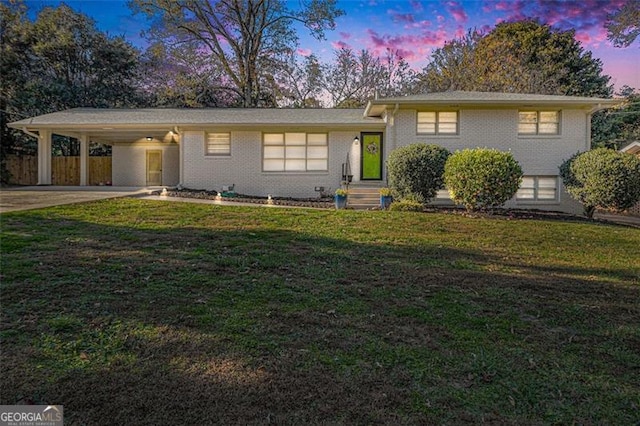 1151 Bromley, Avondale, GA 30002 - tri-level home with an attached carport, driveway, and brick siding