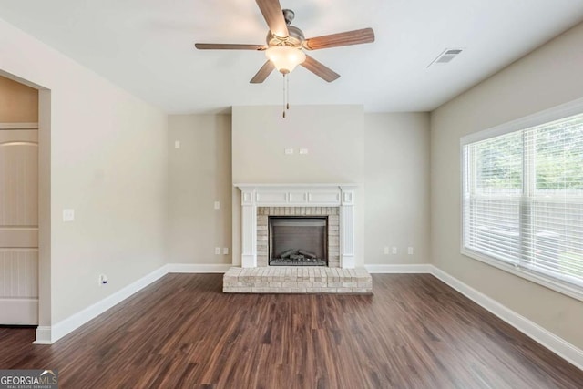 2317 Church St, Hampton, GA 30228 - unfurnished living room with a ceiling fan, dark wood-style flooring, and a fireplace