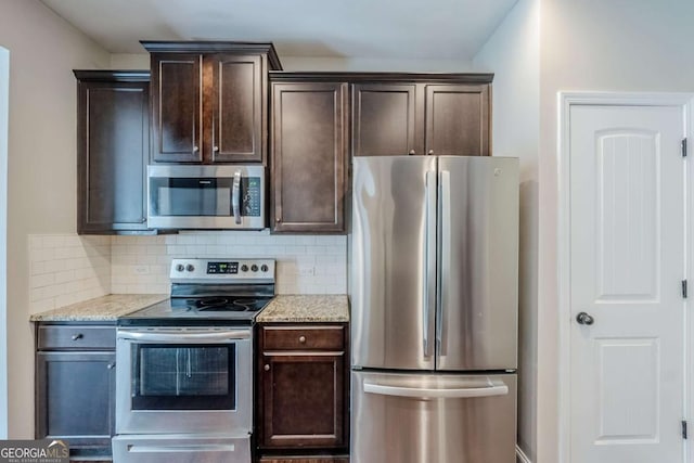 2317 Church St, Hampton, GA 30228 - kitchen featuring stainless steel appliances, dark brown cabinetry, and backsplash