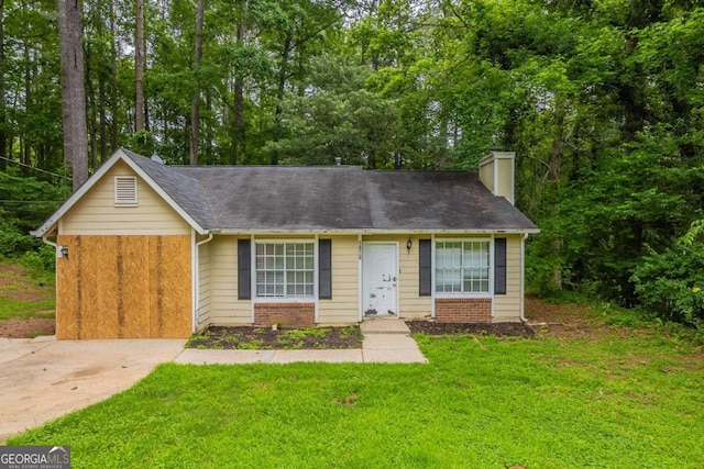 5856 Rock Rd, Union City, GA 30291 - view of front facade with a chimney, a front lawn, and view of scattered trees