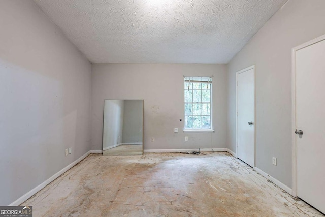5856 Rock Rd, Union City, GA 30291 - unfurnished living room with ceiling fan, vaulted ceiling, and a textured ceiling