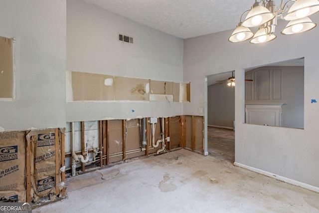 5856 Rock Rd, Union City, GA 30291 - spare room featuring a chandelier, ceiling fan, and a textured ceiling