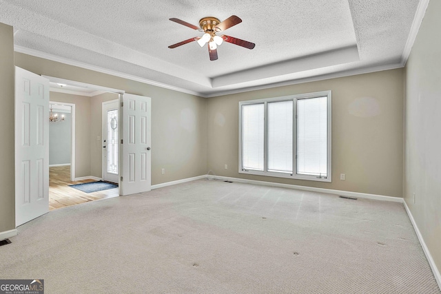 118 Whitfield Run, Peachtree City, GA 30269 - empty room with carpet flooring, a textured ceiling, ornamental molding, a chandelier, and a ceiling fan