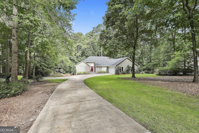 118 Whitfield Run, Peachtree City, GA 30269 - view of front of house with a front yard, concrete driveway, and a garage