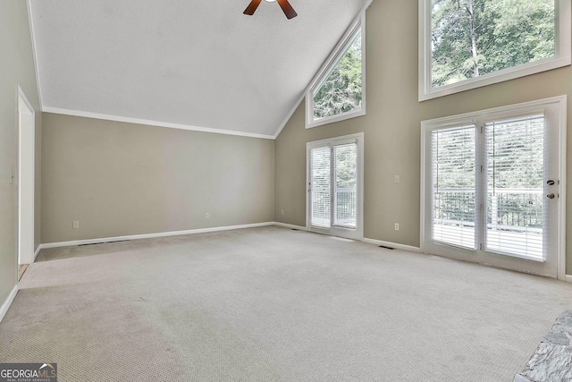 118 Whitfield Run, Peachtree City, GA 30269 - unfurnished living room featuring high vaulted ceiling, ceiling fan, carpet floors, and ornamental molding