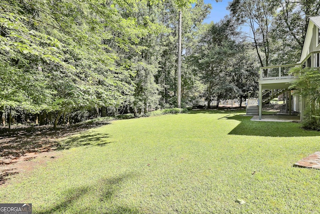 118 Whitfield Run, Peachtree City, GA 30269 - view of green lawn featuring stairs and a deck