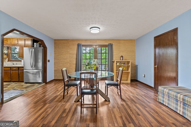 1290 Shadowlawn Dr NE, Conyers, GA 30012 - dining space featuring wood finished floors and a textured ceiling
