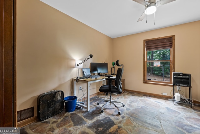 1290 Shadowlawn Dr NE, Conyers, GA 30012 - home office featuring stone flooring and a ceiling fan