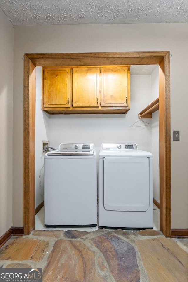 1290 Shadowlawn Dr NE, Conyers, GA 30012 - laundry room featuring cabinet space and independent washer and dryer