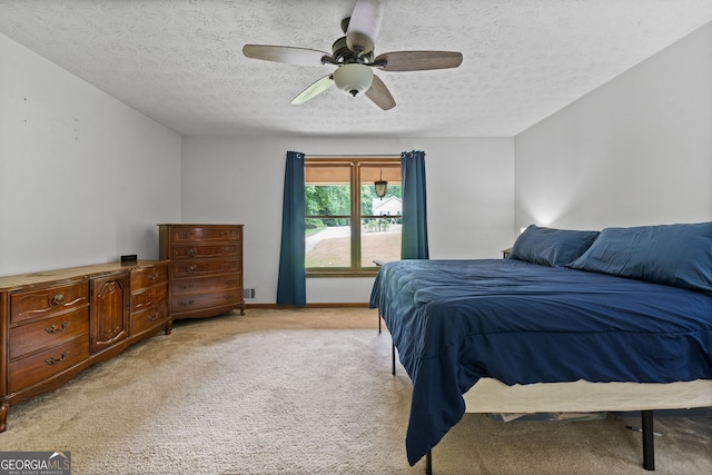 1290 Shadowlawn Dr NE, Conyers, GA 30012 - bedroom featuring a textured ceiling, light colored carpet, and a ceiling fan