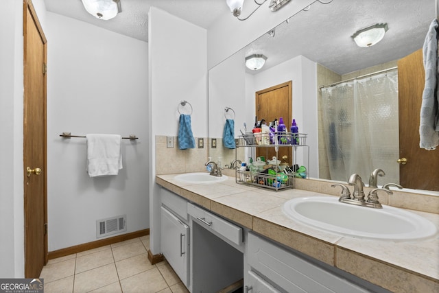 1290 Shadowlawn Dr NE, Conyers, GA 30012 - full bathroom with double vanity, tile patterned floors, a textured ceiling, and curtained shower