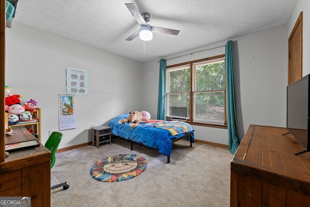 1290 Shadowlawn Dr NE, Conyers, GA 30012 - bedroom with light colored carpet, a textured ceiling, and a ceiling fan
