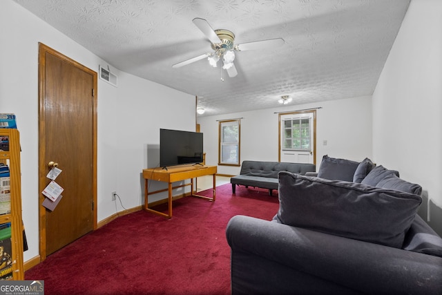1290 Shadowlawn Dr NE, Conyers, GA 30012 - carpeted living room with ceiling fan and a textured ceiling