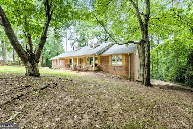 1290 Shadowlawn Dr NE, Conyers, GA 30012 - view of front of property with brick siding and covered porch
