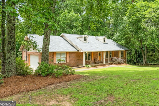 1290 Shadowlawn Dr NE, Conyers, GA 30012 - new england style home with a porch, brick siding, a front yard, and a garage