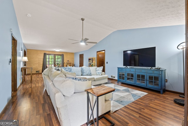 1290 Shadowlawn Dr NE, Conyers, GA 30012 - living room featuring wood finished floors, a ceiling fan, and vaulted ceiling