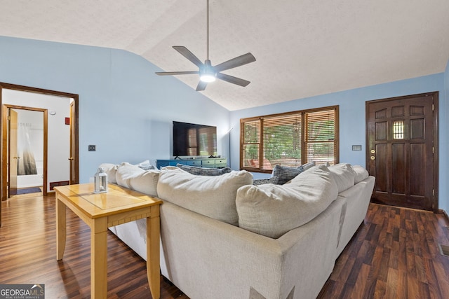 1290 Shadowlawn Dr NE, Conyers, GA 30012 - living room featuring lofted ceiling, ceiling fan, and dark wood-style flooring