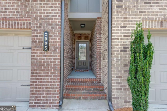 2005 Hamilton Creek Pkwy, Dacula, GA 30019 - property entrance with brick siding, a garage, and board and batten siding