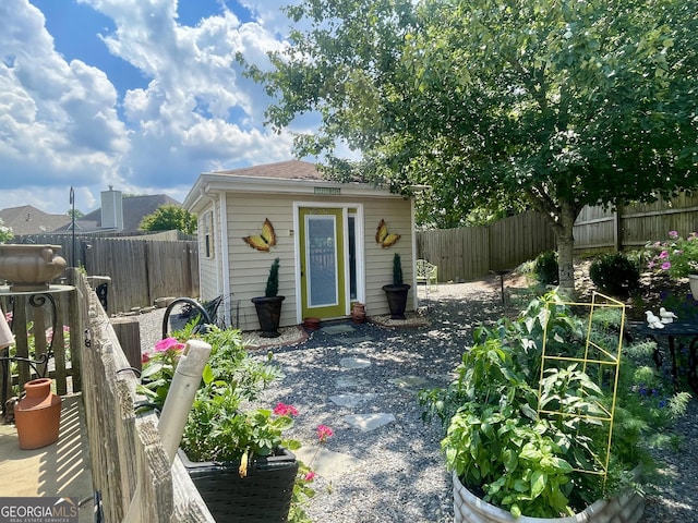 221 Turtle Cv, Carrollton, GA 30116 - fenced backyard featuring an outdoor structure