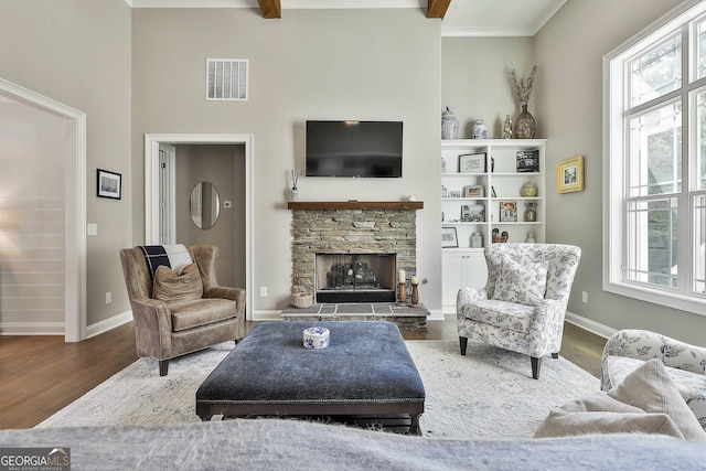 459 N Cove Dr, Newnan, GA 30263 - living area with a towering ceiling, a fireplace, and wood finished floors