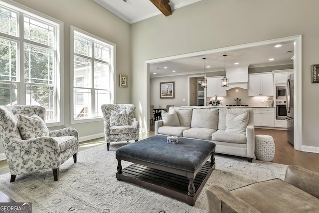 459 N Cove Dr, Newnan, GA 30263 - living area featuring crown molding, wood finished floors, beam ceiling, and recessed lighting