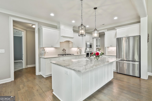 459 N Cove Dr, Newnan, GA 30263 - kitchen featuring appliances with stainless steel finishes, ornamental molding, white cabinetry, tasteful backsplash, and recessed lighting