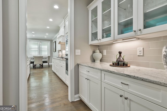 459 N Cove Dr, Newnan, GA 30263 - bar area featuring backsplash, wood finished floors, recessed lighting, and crown molding