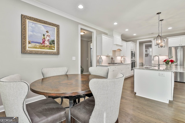 459 N Cove Dr, Newnan, GA 30263 - dining room featuring crown molding, wood finished floors, and recessed lighting