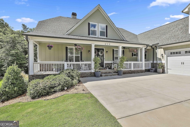 459 N Cove Dr, Newnan, GA 30263 - view of front of home with covered porch, a chimney, a shingled roof, concrete driveway, and board and batten siding