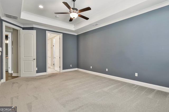 459 N Cove Dr, Newnan, GA 30263 - unfurnished bedroom with a tray ceiling, carpet flooring, ornamental molding, recessed lighting, and ceiling fan