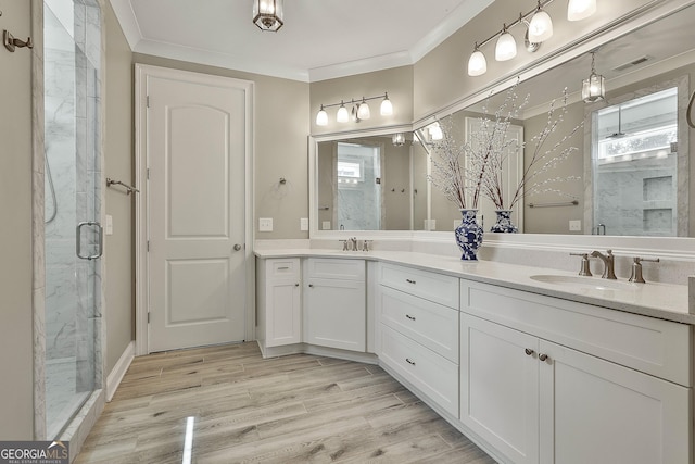 459 N Cove Dr, Newnan, GA 30263 - bathroom featuring a marble finish shower, double vanity, crown molding, and wood finished floors