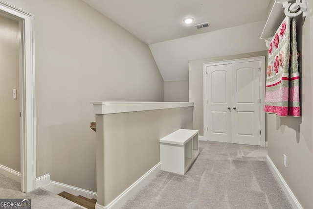 459 N Cove Dr, Newnan, GA 30263 - hall with an upstairs landing, light carpet, and vaulted ceiling