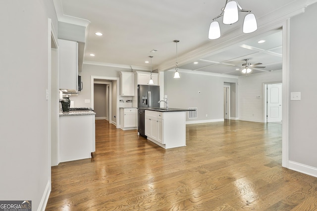 459 N Cove Dr, Newnan, GA 30263 - kitchen with stainless steel fridge, crown molding, a ceiling fan, recessed lighting, and white cabinetry
