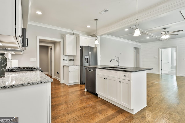 459 N Cove Dr, Newnan, GA 30263 - kitchen with dishwasher, crown molding, wood finished floors, white cabinetry, and a ceiling fan