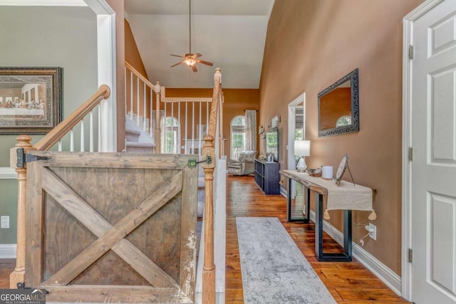 119 Creekside Vw, Hiram, GA 30141 - foyer with a ceiling fan, wood finished floors, lofted ceiling, and stairway