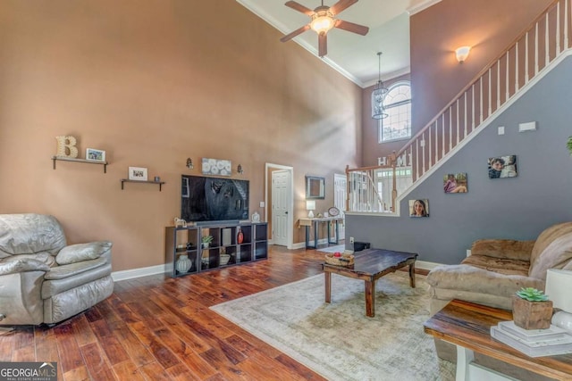 119 Creekside Vw, Hiram, GA 30141 - living room with ornamental molding, stairway, wood finished floors, a ceiling fan, and a towering ceiling