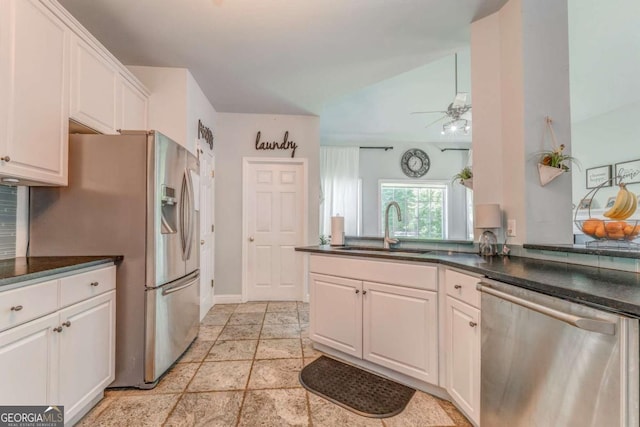 119 Creekside Vw, Hiram, GA 30141 - kitchen with stainless steel appliances, a ceiling fan, stone tile floors, dark countertops, and white cabinets