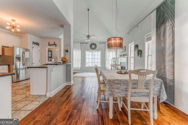 119 Creekside Vw, Hiram, GA 30141 - dining space featuring a chandelier, light wood-style flooring, a ceiling fan, and lofted ceiling